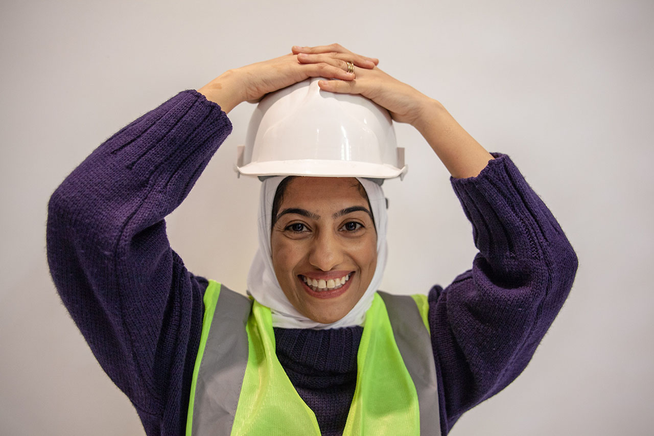 Manahil smiling in hard hat