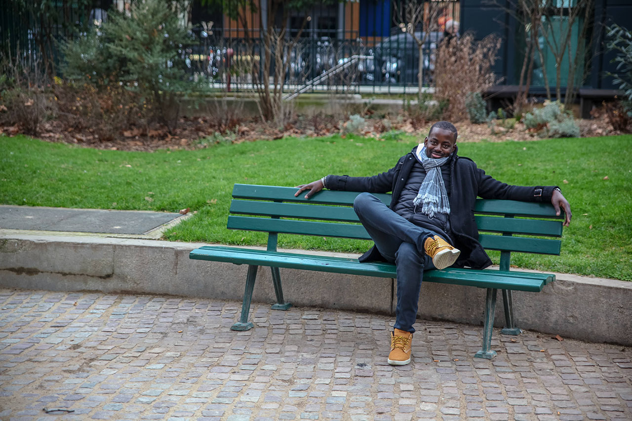 Demba relaxing on a bench